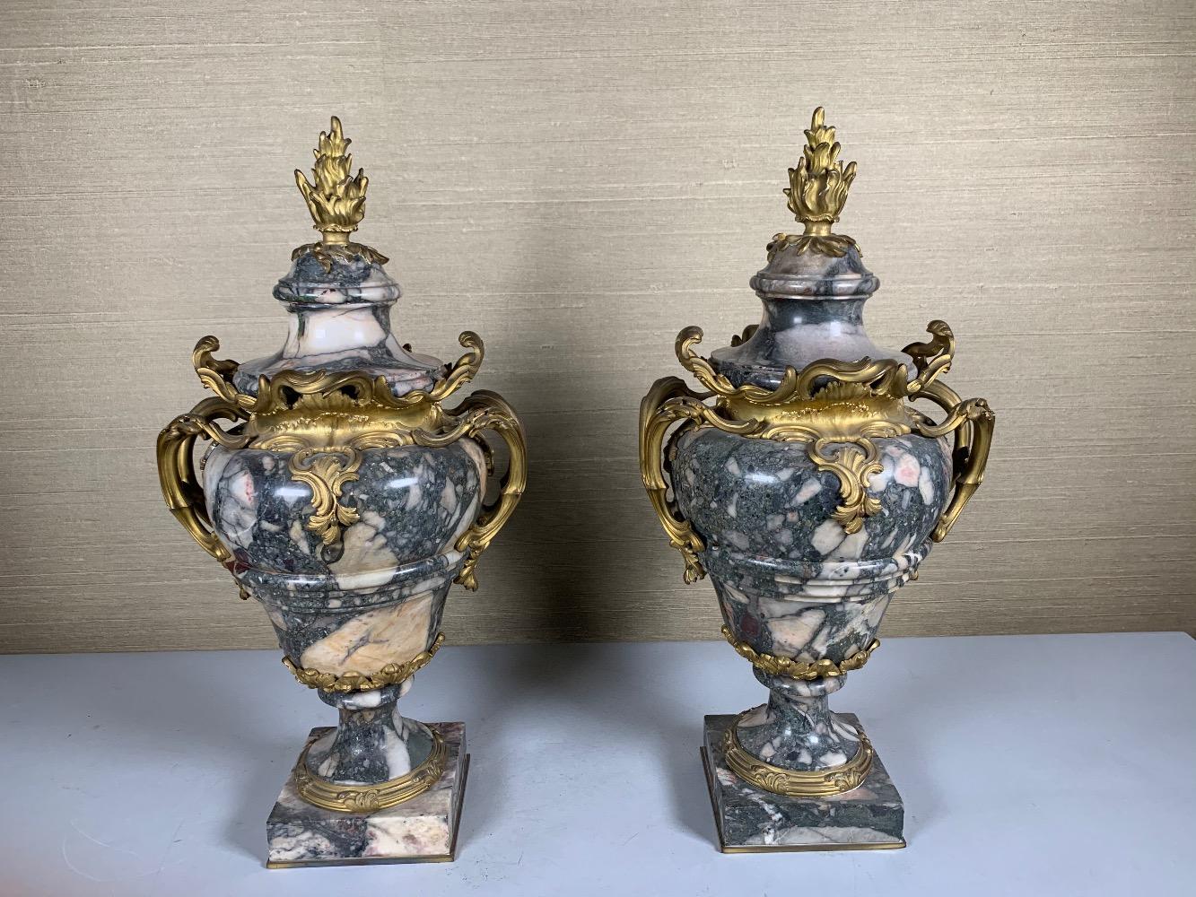 Pair of marble and gilded bronze vases.