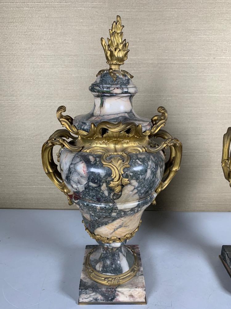 Pair of marble and gilded bronze vases.