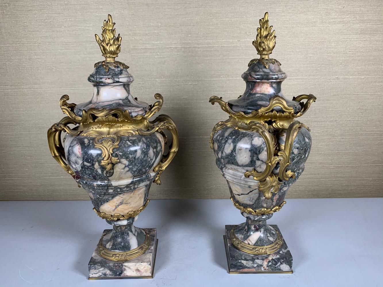 Pair of marble and gilded bronze vases.