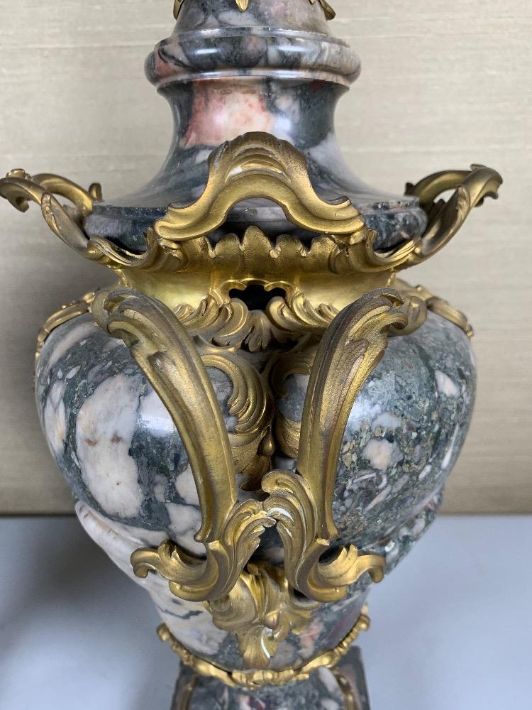 Pair of marble and gilded bronze vases.